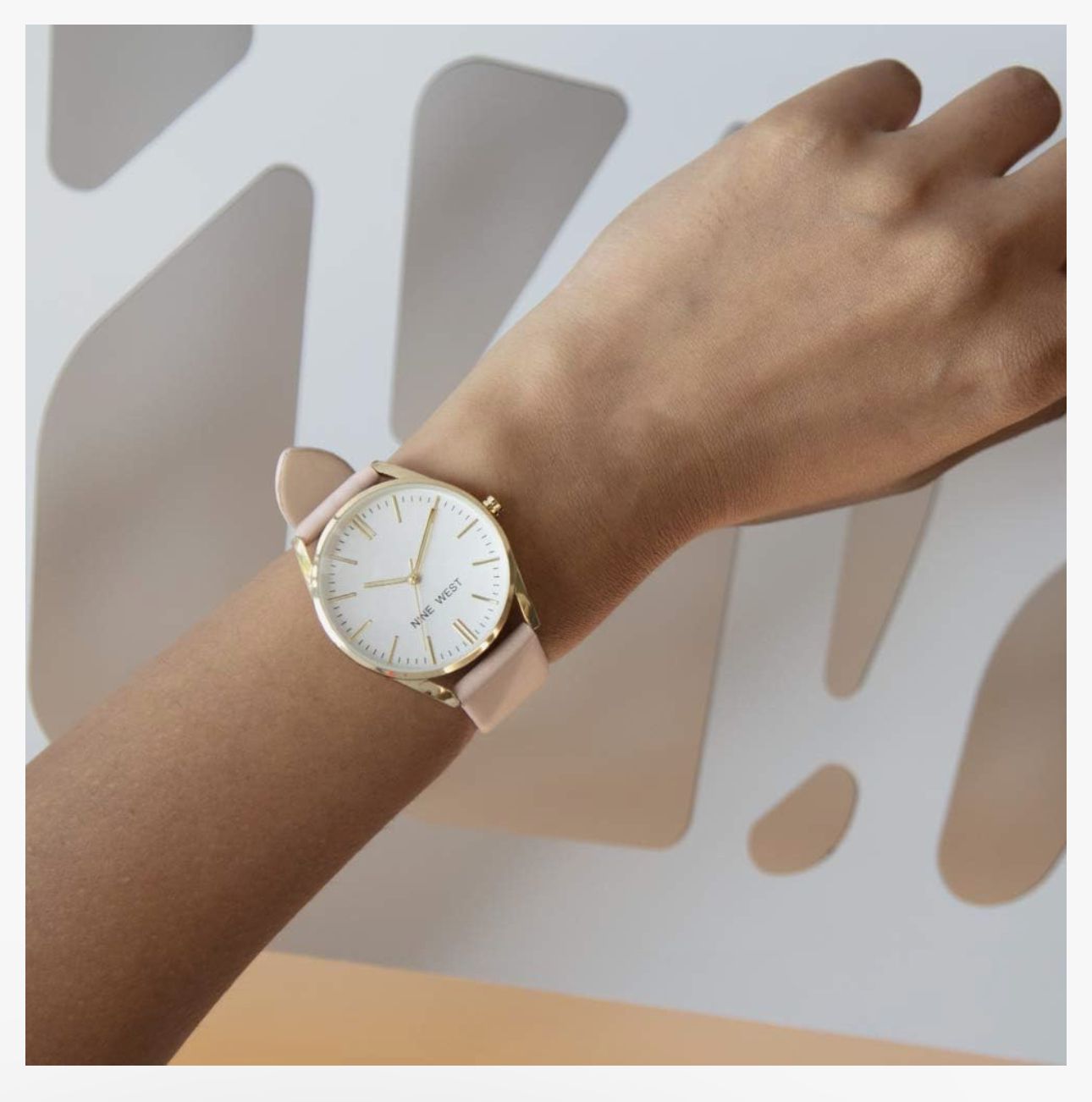 Round Golden Nine West Watch w/ Pink band.